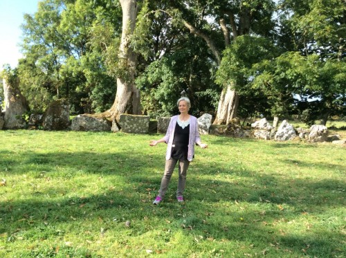 Jackie Queally in Lough Gur Stone Circle on Earthwise Sacred Ireland tour